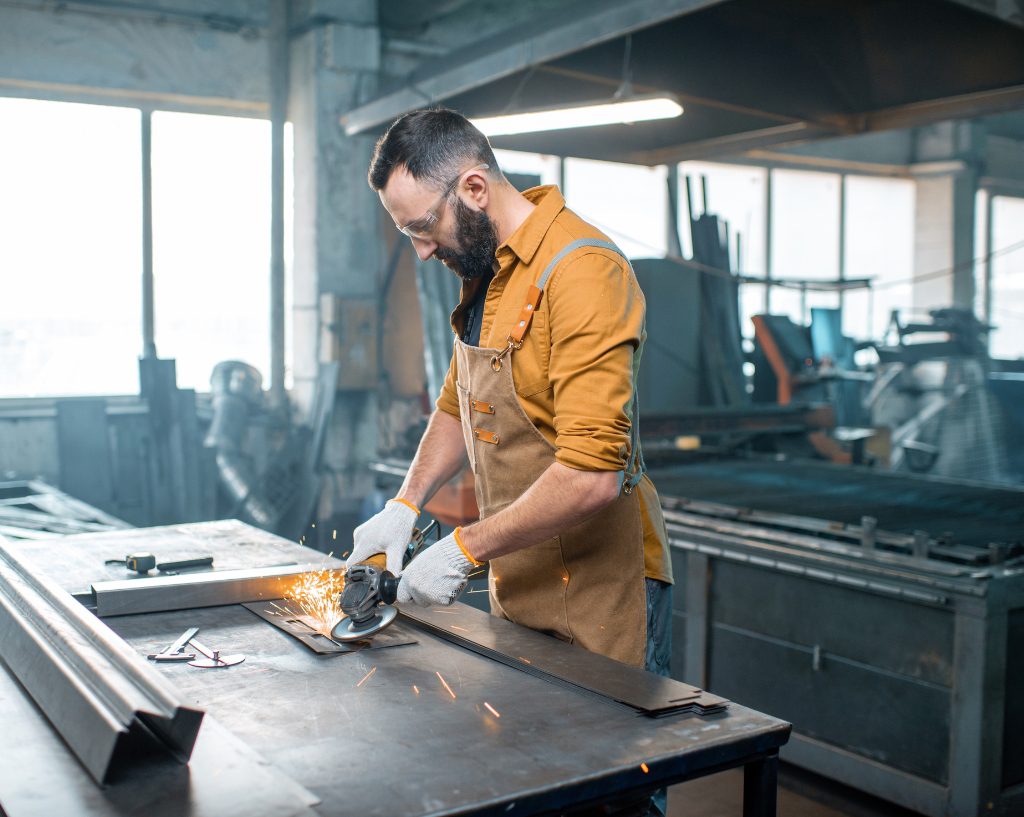 Man grinding metal